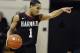 Harvard's Siyani Chambers, points and smiles at his team as he dribbles in the final seconds of an NCAA college basketball game against Yale, Friday, March 7, 2014, in New Haven, Conn. Harvard won 70-58. (AP Photo/Jessica Hill)