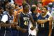 GREENSBORO, NC - MARCH 14: Talib Zanna #42 of the Pittsburgh Panthers celebrates on the bench with teammates against the North Carolina Tar Heels during the quarterfinals of the 2014 Men's ACC Basketball Tournament at Greensboro Coliseum on March 14, 2014 in Greensboro, North Carolina. (Photo by Streeter Lecka/Getty Images)