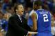 ATLANTA, GA - MARCH 16: Head coach John Calipari of the Kentucky Wildcats talks to Aaron Harrison #2 in the first half against the Florida Gators during the Championship game of the 2014 Men's SEC Basketball Tournament at Georgia Dome on March 16, 2014 in Atlanta, Georgia. (Photo by Kevin C. Cox/Getty Images)