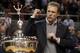 Auburn coach Gus Malzahn sings the Auburn fight song as he accepts the Foy-ODK Sportsmanship trophy during halftime of an NCAA college basketball game, Thursday, Jan. 30, 2014, in Auburn, Ala. (AP Photo/Butch Dill)