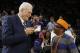 Former NBA coach Phil Jackson, left, and director Spike Lee, right, talk before a ceremony to honor the 1972-73 Championship New York Knicks team during the first half of an NBA basketball game between the Knicks and the Milwaukee Bucks, Friday, April 5, 2013, in New York. (AP Photo/Frank Franklin II)