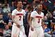 MEMPHIS, TN - MARCH 15: Russ Smith #2 and Chris Jones #3 of the Louisville Cardinals walk towards the bench against the Connecticut Huskies during the Championship of the American Athletic Conference Tournament at FedExForum on March 15, 2014 in Memphis, Tennessee. Louisville defeated Connecticut 71-61. (Photo by Joe Murphy/Getty Images)