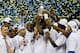 ATLANTA, GA - MARCH 16: The Florida Gators celebrate with the trophy after their 61 to 60 win over the Kentucky Wildcats in the Championship game of the 2014 Men's SEC Basketball Tournament at Georgia Dome on March 16, 2014 in Atlanta, Georgia. (Photo by Kevin C. Cox/Getty Images)