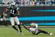 Carolina Panthers' Brandon LaFell (11) controls the catch and turns away from New Orleans Saints' Malcolm Jenkins (27) during the second half an NFL football game in Charlotte, N.C., Sunday, Dec. 22, 2013. The Panthers won 17-13. (AP Photo/Bob Leverone)