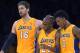Los Angeles Lakers center Pau Gasol, left, of Spain, guard Jodie Meeks, center, and forward Nick Young celebrate in the closing seconds of an NBA basketball game against the Utah Jazz, Friday, Jan. 3, 2014, in Los Angeles. (AP Photo/Mark J. Terrill)