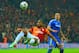 ISTANBUL, TURKEY - FEBRUARY 26: John Terry of Chelsea looks on as Didier Drogba of Galatasaray clears the ball during the UEFA Champions League Round of 16 first leg match between Galatasaray AS and Chelsea at Ali Sami Yen Arena on February 26, 2014 in Istanbul, Turkey. (Photo by Michael Regan/Getty Images)
