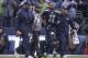 Percy Harvin being helped off the field after suffering a concussion in the divisional playoff game against the New Orleans Saints.