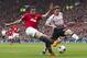 Manchester United's Robin van Persie, fights for the ball against Liverpool's Joe Allen during their English Premier League soccer match at Old Trafford Stadium, Manchester, England, Sunday March 16, 2014. (AP Photo/Jon Super)