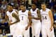 KANSAS CITY, MO - MARCH 13: Andrew Wiggins #22, Naadir Tharpe #10, Wayne Selden, Jr. #1, Jamari Traylor #31, and Perry Ellis #34 of the Kansas Jayhawks walk toward the bench during a timeout in the Big 12 Basketball Tournament quarterfinal game against the Oklahoma State Cowboys at Sprint Center on March 13, 2014 in Kansas City, Missouri. (Photo by Jamie Squire/Getty Images)