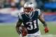 FOXBORO, MA - SEPTEMBER 12: Aqib Talib #31 of the New England Patriots runs the ball after he intercepted a pass intended for a New York Jets receiver in the 4th quarter at Gillette Stadium on September 12, 2013 in Foxboro, Massachusetts. (Photo by Jim Rogash/Getty Images)