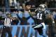 Carolina Panthers' Captain Munnerlyn (41) looks to the end zone crowd as he runs his interception against the New York Jets into the end zone during the second half of an NFL football game in Charlotte, N.C., Sunday, Dec. 15, 2013. The Panthers won 30-20. (AP Photo/Bob Leverone)