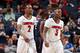 MEMPHIS, TN - MARCH 15: Russ Smith #2 and Chris Jones #3 of the Louisville Cardinals walk towards the bench against the Connecticut Huskies during the Championship of the American Athletic Conference Tournament at FedExForum on March 15, 2014 in Memphis, Tennessee. Louisville defeated Connecticut 71-61. (Photo by Joe Murphy/Getty Images)