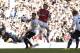 Arsenal's Tomas Rosicky, right, scores past Tottenham Hotspur's Jan Vertonghen during the English Premier League soccer match between Tottenham Hotspur and Arsenal at White Hart Lane stadium in London, Sunday, March 16, 2014. (AP Photo/Matt Dunham)