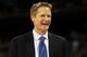 HOUSTON, TX - APRIL 04: Broadcaster Steve Kerr smiles on the court before the National Championship Game of the 2011 NCAA Division I Men's Basketball Tournament between the Butler Bulldogs and Connecticut Huskies at Reliant Stadium on April 4, 2011 in Houston, Texas. (Photo by Streeter Lecka/Getty Images)