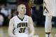Iowa forward Aaron White sits on the court after being called for a foul during the first half of an NCAA college basketball game against Minnesota, Sunday, Jan. 19, 2014, in Iowa City, Iowa. (AP Photo/Charlie Neibergall)