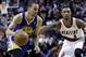 Golden State Warriors guard Stephen Curry, left, drives past Portland Trail Blazers guard Damian Lillard during the first half of an NBA basketball game in Portland, Ore., Sunday, March 16, 2014. (AP Photo/Don Ryan)
