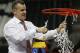 Florida head coach Billy Donovan takes the net after the second half of an NCAA college basketball game against Kentucky in the Championship round of the Southeastern Conference men's tournament, Sunday, March 16, 2014, in Atlanta. Florida won 61-60. (AP Photo/John Bazemore)