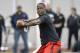 Louisville quarterback Teddy Bridgewater participates in a passing drill for NFL representatives during pro day at the University of Louisville in Louisville, Ky., Monday, March 17, 2014. (AP Photo/Timothy D. Easley)