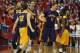 Albany' Gary Johnson (20), Peter Hooley (12), John Puk (44), Luke Devlin (11) and DJ Evans (3) celebrate after Albany beat Stony Brook 69-69 in an NCAA college basketball game to win the championship of the America East Conference tournament Saturday, March 15, 2014, in Stony Brook, N.Y. (AP Photo/Kathy Kmonicek)