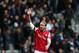 Arsenal's Nicklas Bendtner celebrates their victory over Newcastle United at the end of their English Premier League soccer match at St James' Park, Newcastle, England, Sunday, Dec. 29, 2013. Arsenal beat Newcastle by 1-0. (AP Photo/Scott Heppell)