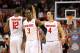 Feb 22, 2014; Columbus, OH, USA; Ohio State Buckeyes Sam Thompson (12) Shannon Scott (3) and Aaron Craft (4) celebrate after an alleyoop play during the second half of the game against the Minnesota Golden Gophers at Schottenstein Center. Mandatory Credit: Rob Leifheit-USA TODAY Sports