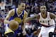 Golden State Warriors guard Stephen Curry, left, drives past Portland Trail Blazers guard Damian Lillard during the first half of an NBA basketball game in Portland, Ore., Sunday, March 16, 2014. (AP Photo/Don Ryan)
