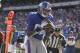 New York Giants wide receiver Mario Manningham (82) catches a pass for a touchdown during the second quarter of an NFL football game against the Miami Dolphins Sunday, Oct. 30, 2011 in East Rutherford, N.J. (AP Photo/Julio Cortez)