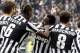 Juventus midfielder Kwadwo Asamoah, center of Ghana, celebrates after scoring during a Serie A soccer match between Juventus and Fiorentina at the Juventus stadium, in Turin, Italy, Sunday, March 9, 2014. (AP Photo/Massimo Pinca)