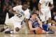Villanova's JayVaughn Pinkston, left, and Seton Hall's Jaren Sina fight for a lose ball during the first half of an NCAA college basketball game in the quarterfinals of the Big East Conference tournament at Madison Square Garden, Thursday, March 13, 2014, in New York. (AP Photo/Seth Wenig)