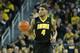 ANN ARBOR, MI - JANUARY 22: Roy Devyn Marble #4 of the Iowa Hawkeyes brings the ball up the court during the second half of the game against the Michigan Wolverines at Crisler Arena on January 22, 2014 in Ann Arbor, Michigan. The Wolverines defeated the Hawkeyes 75-67. (Photo by Leon Halip/Getty Images)