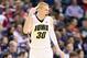 INDIANAPOLIS, IN - MARCH 13: Aaron White #30 of the Iowa Hawkeyes celebrates after making a three point shot in the game against the Northwestern Wildcats during the first round of the Big Ten Basketball Tournament at Bankers Life Fieldhouse on March 13, 2014 in Indianapolis, Indiana. (Photo by Andy Lyons/Getty Images)