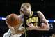 Iowa's Aaron White, right, is held by Penn State's Jack Donovan during the second half of an NCAA college basketball game on Saturday, Feb. 15, 2014, in State College. No foul was called on the play. Iowa won 82-70. (AP Photo/Keith Srakocic)