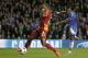 Chelsea's Samuel Eto'o, right, shoots and scores the opening goal during the Champions League last 16 second leg soccer match between Chelsea and Galatasaray at Stamford Bridge stadium in London, Tuesday, March 18, 2014. (AP Photo/Matt Dunham)