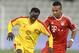 Bayern Munich's Julian Green, right, of Munich and Balla Jabir of Al-Merrikh, challenge for the ball, during their friendly soccer match, at Al-Saad stadium in Doha Thursday, Jan. 9, 2014. (AP Photo/Osama Faisal)