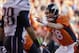 FILE - In this Jan 19, 2014 file photo, Denver Broncos quarterback Peyton Manning calls out a play during the second half of the AFC championship NFL playoff football game against the New England Patriots in Denver. Unless Manning changes his habits, the Super Bowl-watching world will get to hear “Omaha!” again and again this Sunday. The Denver Broncos quarterback’s word choice at the line of scrimmage has cast a bright light on the Midwestern city over the past few weeks. Omaha has been mentioned thousands of times on Twitter and in media stories, and been visited by everyone from ESPN to the NFL Network. (AP Photo/Charlie Riedel, File)