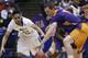 Mount St. Mary's guard Julian Norfleet, left, and Albany forward Luke Devlin chase a loose ball in the first half of a first-round game of the NCAA college basketball tournament, Tuesday, March 18, 2014, in Dayton, Ohio. (AP Photo/Al Behrman)
