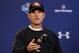 San Francisco 49ers head coach Jim Harbaugh answers a question during a news conference at the NFL football scouting combine in Indianapolis, Thursday, Feb. 20, 2014. (AP Photo/Michael Conroy)