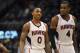 Atlanta Hawks guard Jeff Teague (0), who tied his career high with 34 points, and teammate Paul Millsap, who recorded his first career triple-double with 19 points, 13 rebounds and 2210 assists, walk off the court during overtime of their NBA basketball game against the Toronto Raptors Tuesday, March 18, 2014, in Atlanta. Atlanta won 118-113. (AP Photo/David Tulis)