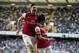 Arsenal's Tomas Rosicky, right, celebrates scoring with teammate Olivier Giroud during the English Premier League soccer match between Tottenham Hotspur and Arsenal at White Hart Lane stadium in London, Sunday, March 16, 2014. (AP Photo/Matt Dunham)