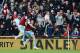 STOKE ON TRENT, ENGLAND - MARCH 15: Andy Carroll of West Ham United celebrates in front of Stoke City fans with James Tomkins of West Ham United as he scores their first goal during the Barclays Premier League match between Stoke City and West Ham United at Britannia Stadium on March 15, 2014 in Stoke on Trent, England. (Photo by Ross Kinnaird/Getty Images)