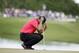 Tiger Woods bows his head on the fourth green during the final round of the Cadillac Championship golf tournament on Sunday, March 9, 2014, in Doral, Fla. Woods made bogey on the hole. (AP Photo/Lynne Sladky)