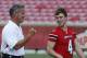 In this photo taken Sunday, Aug. 7, 2011, Louisville quarterback coach Shawn Watson and quarterback Will Stein (4) walk onto the field for a photo session prior to their NCAA college football season in Louisville, Ky. (AP Photo/Ed Reinke)