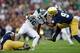 Sep 21, 2013; South Bend, IN, USA; Notre Dame Fighting Irish cornerback KeiVarae Russell (6) and linebacker Jaylon Smith (9) tackle Michigan State Spartans wide receiver Aaron Burbridge (16) in the fourth quarter at Notre Dame Stadium. Notre Dame won 17-13. Mandatory Credit: Matt Cashore-USA TODAY Sports