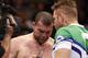 Mauricio 'Shogun' Rua is consoled by his cornerman after losing to Chael Sonnen in their UFC on Fox Sports 1 mixed martial arts light heavyweight bout in Boston, Saturday, August 17,2013. Sonnen won via first round tapout via guillotine choke. (AP Photo/Gregory Payan)