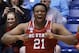 North Carolina State forward Beejay Anya celebrates on the bench in the closing seconds of the team's 74-59 win over Xavier in a first-round game of the NCAA college basketball tournament, Tuesday, March 18, 2014, in Dayton, Ohio. (AP Photo/Al Behrman)