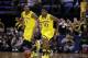Michigan guard Derrick Walton Jr. (10) drives against Michigan State in the first half of an NCAA college basketball game in the championship of the Big Ten Conference tournament Sunday, March 16, 2014, in Indianapolis. (AP Photo/Kiichiro Sato)