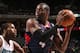 CHARLOTTE, NC - MARCH 17: Paul Millsap #4 of the Atlanta Hawks looks to pass against Michael Kidd-Gilchrist #14 of the Charlotte Bobcats during the game at the Time Warner Cable Arena on March 17, 2014 in Charlotte, North Carolina. NOTE TO USER: User expressly acknowledges and agrees that, by downloading and or using this photograph, User is consenting to the terms and conditions of the Getty Images License Agreement. Mandatory Copyright Notice: Copyright 2014 NBAE (Photo by Brock Williams-Smith/NBAE via Getty Images)