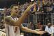 Florida guard Scottie Wilbekin (5) does the gator chomp as he leaves the court after Florida defeated LSU 79-61 in an NCAA college basketball game Saturday, March 1, 2014 in Gainesville, Fla. (AP Photo/Phil Sandlin)