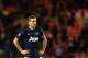 Manchester United's captain Nemanja Vidic stands dejected after being defeated by Sunderland at the end of their English League Cup semifinal first leg soccer match at the Stadium of Light, Sunderland, England, Tuesday, Jan. 7, 2014. (AP Photo/Scott Heppell)