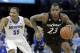 Cincinnati guard Sean Kilpatrick (23) drives past Memphis guard Geron Johnson (55) in the second half of an NCAA college basketball game Saturday, Jan. 4, 2014, in Memphis, Tenn. Kilpatrick led Cincinnati with 18 points as Cincinnati won 69-53. (AP Photo/Mark Humphrey)